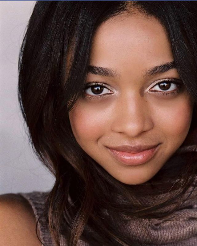 Juliet Gordy in a brown dress.